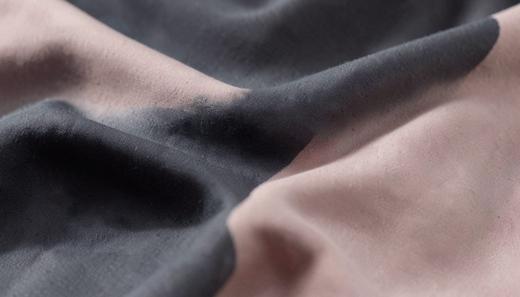 Softly lit fabric textures in muted charcoal and blush tones, evoking a sleek and confident body-shaping aesthetic